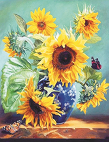 Букет подсолнухов в синей вазе